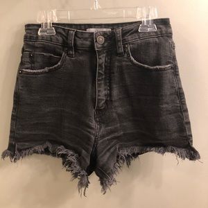 Distressed black denim shorts